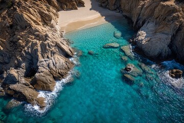 Beautiful turquoise waters surround rocky coastline on a secluded beach during sunny day