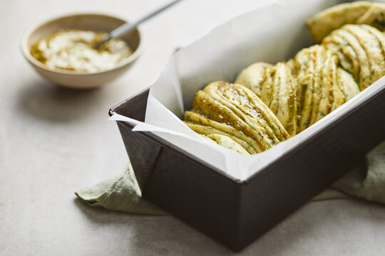 Babka braided bread with cheese and pesto flavor