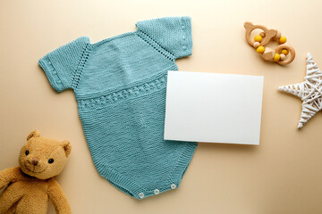 Newborn baby clothes mockup featuring hand-knitted, soft, and cozy babywear flatlay with a minimalist infant outfit