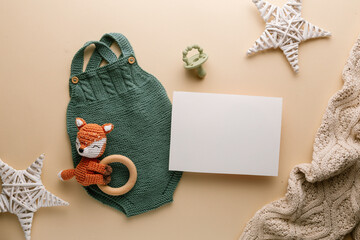 Newborn baby clothes mockup featuring hand-knitted, soft, and cozy babywear flatlay with a minimalist infant outfit