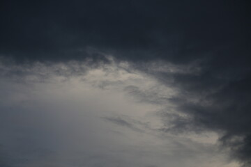 Dramatic and Ominous Dark Storm Clouds Gather in the Evening Sky.