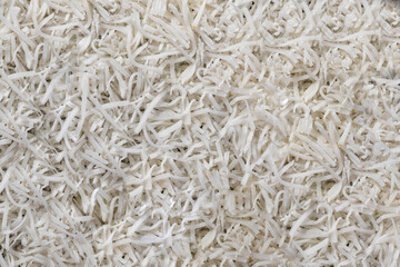 Fresh coconut flakes, texture, background, top view