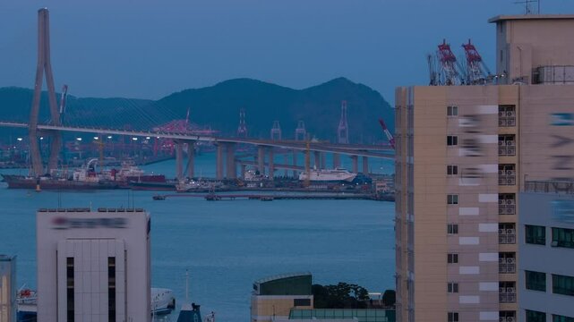 Busan, South Korea. Aerial view of skyscrapers in Busan, South Korea. Time-lapse during a cloudy spring evening, panning video
