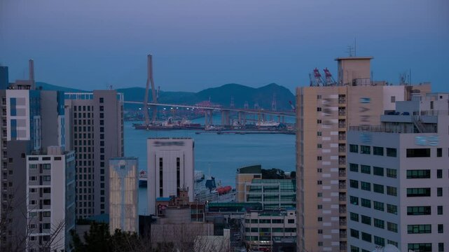 Busan, South Korea. Aerial view of skyscrapers in Busan, South Korea. Time-lapse during a cloudy spring evening