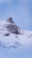 Majestic snowy mountain peak in Senja, Norway