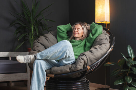 Happy middle aged Woman relaxing at home