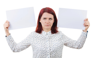 Confused young woman holding two blank paper sheets in her hands poinded to the left and right...