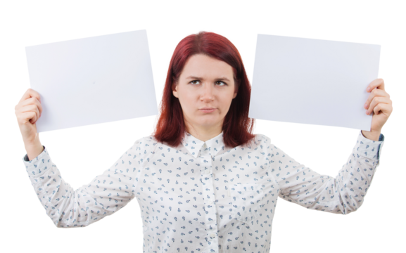 Confused young woman holding two blank paper sheets in her hands poinded to the left and right sides. Human emotion, face expression life perception concept. Business decision and choice symbol