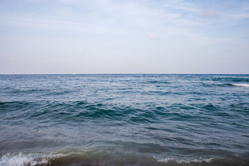 Tranquil Day at the Beach with Gentle Ocean Waves