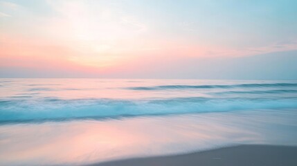 Fototapeta premium A serene beach scene with soft, pastel skies, the waves gently rolling in, and a blurred, dreamlike effect over the horizon. --ar 16:9 --v 6.1 Job ID: 475a78ed-9545-4dec-97f5-163767c1f2a5