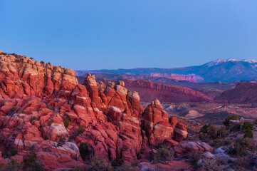 Fiery Furnace canyons of Arches National park at sunset with LaSalle snowcapped mountains on the background, Southwest USA