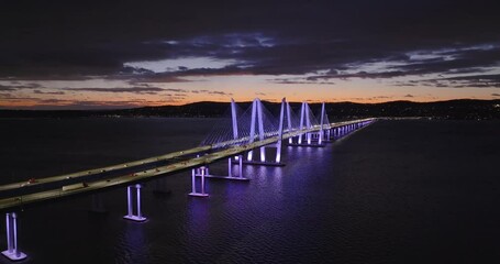 Tarrytown, NY - USA - January 15, 2025: Night aerial panning video of the Governor Mario M. Cuomo Bridge, spanning the Hudson River between Tarrytown and Nyack
