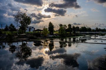 Fototapeta premium Dramatic Sunset Over Reflected Trees and Sky in a Park Lake, Başiskele, Kocaeli, Türkiye