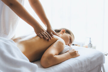 Caucasian woman customer enjoying relaxing anti-stress spa massage and pampering with beauty skin...