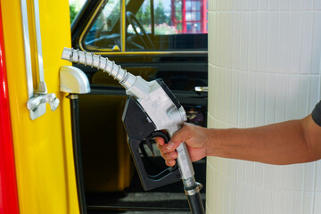 Close up fuel nozzles at gas station,Petrol pump filling fuel nozzle in gas station,Fuel Pump,Gas...