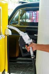 Close up fuel nozzles at gas station,Petrol pump filling fuel nozzle in gas station,Fuel Pump,Gas Station,Gasoline,service station,The concept of fuel energy.