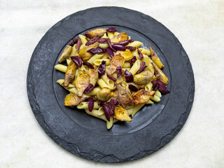 Pasta with black olives and artichoke hearts,