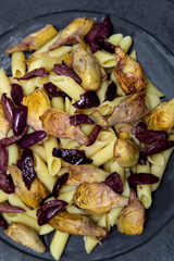 Pasta with black olives and artichoke hearts,