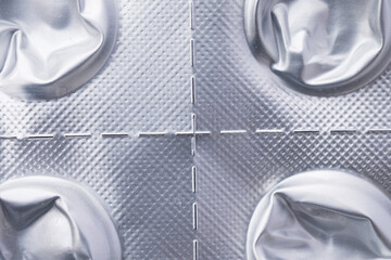 Closeup of used aluminum blister pack
