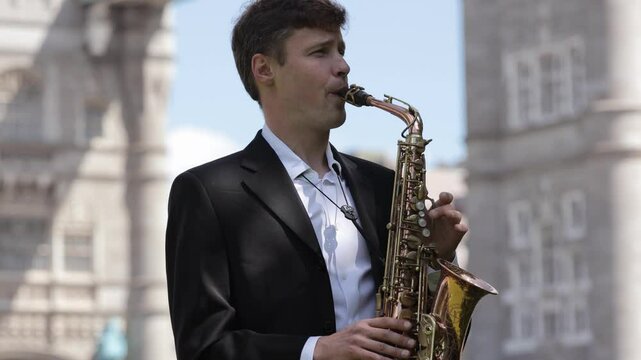 On a summer day, a jazzman fills the city streets with beaut