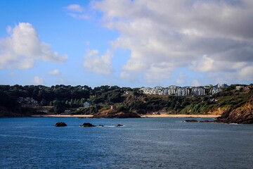 Obraz premium Coast of Jersey Island seen from water, Channel Islands