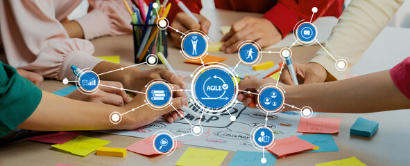 Engaging team brainstorming session showcasing agile methodology with hands collaborating over...