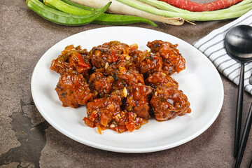Manchurian chicken with sauce and spices