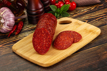 Spicy pepperoni sausages with sliced piece