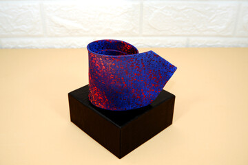 A necktie rolled on gift box closeup shot , Fathers day  gift concept 