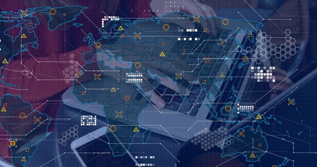 Image of world map over person using laptop