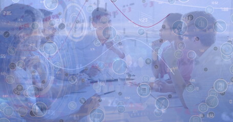 Network of digital icons and data processing over diverse businesspeople discussing at office