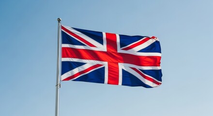 United Kingdom flag waving against clear blue sky