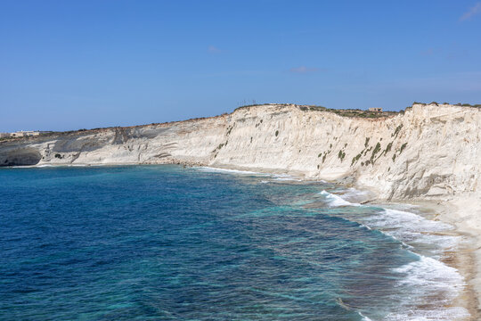 The stunning white cliffs of Munxar with deep blue sea below, island of Malta.