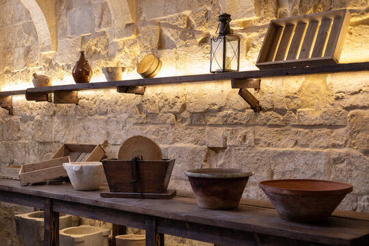 Valletta, Malta - 05.12.2025: Antique kitchen interior with vintage utensils and ceramic pots in the Inquisitor Palace, Valletta, Malta.