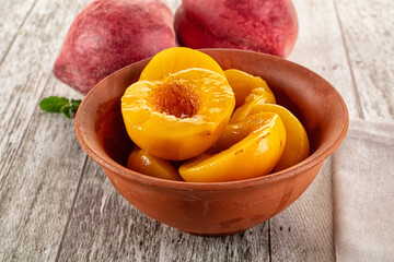 Sweet ripe yellow canned peaches