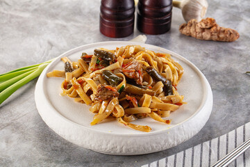 Asian cuisine udon with chicken and vegetables