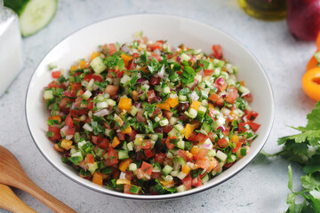 A bowl with traditional vegetable Israeli Salad