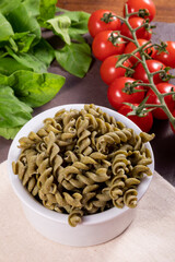 Raw spinach screw noodles, vegetarian, vegan . Healthy food