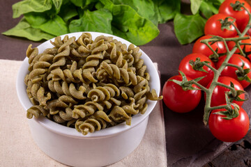 Raw spinach screw noodles, vegetarian, vegan . Healthy food