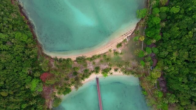 Serene tropical bay and Ko Ngam beach bathed in sunrise, koh Chang. Aerial drone video