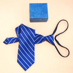 A zipper tie folded with gift box flat lay photography, gift concept  