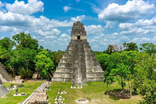 The majestic Pyramid of Tikal rises from the Guatemalan jungle, showcasing ancient Mayan architecture, rich history, and breathtaking views in a UNESCO World Heritage Site.