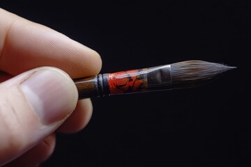 I grip a brush for calligraphy