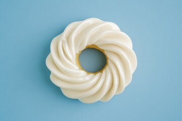 Iced donut seen from above on stylish blue surface