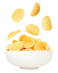 Tasty crispy potato chips falling into bowl on white background