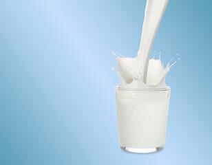 Pouring fresh milk into glass against light blue background. Liquid splashing out of glass