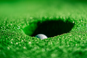 Golf hole with a goal ball on a green grass field