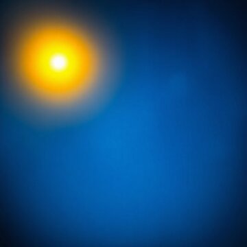 Halo de lumi&egrave;re jaune sur un fond bleu qui comporte des petites &eacute;toiles