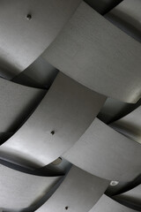 The concrete ceiling has a structure that resembles the bamboo woven square pattern