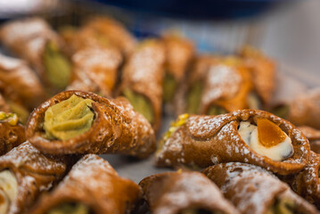 View of Amalfi town featuring coastal buildings, a luxury hotel, and the Tyrrhenian Sea. The scene includes restaurants and scenic sea views.